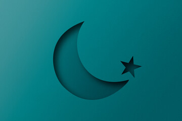 green paper cut into holes The crescent moon is overlaid with light and shadow.