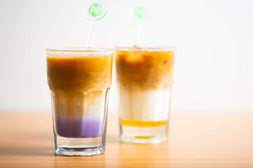 A Cup of latte served with syrup