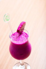 Dragonfruit smoothie served with a slice of dragonfruit