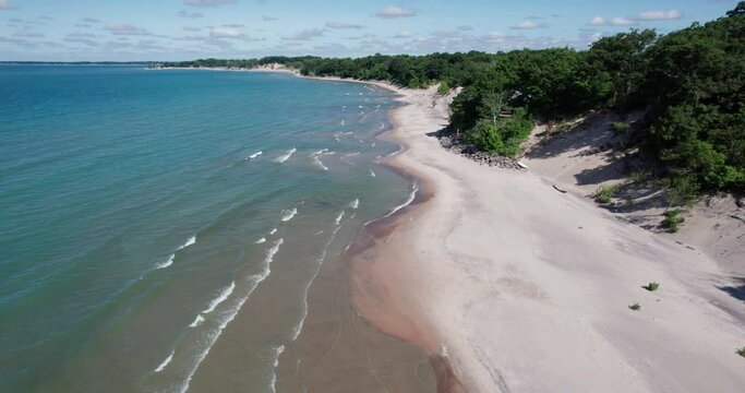 Flying Over a Beach in the Summer Waves Coming In Shoreline
