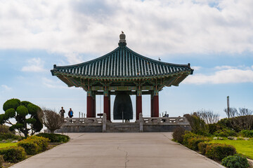 Fototapeta premium Korean Friendship Bell in San Pedro, California. Photos taken of the ornate pavilion and bell in a public park on a winter day in Los Angeles.