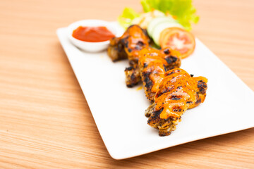 Buffalo wings served with a sauce