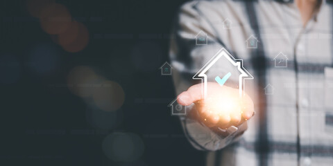 House icon in realtor's hand ,Property insurance ,real estate business, investment savings , mortgages and bank loans,home loan contract, Buying real estate concept,home insurance and investment loan