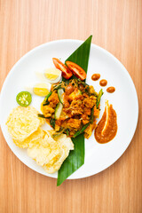 A Plate of indonesian salad, gado gado served with peanut sauce