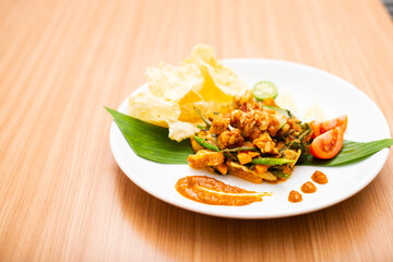A Plate of indonesian salad, gado gado served with peanut sauce