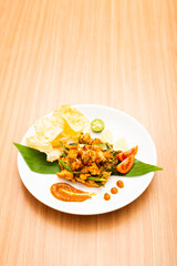 A Plate of indonesian salad, gado gado served with peanut sauce