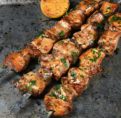 Grilled barbecue with herbs and lemon
