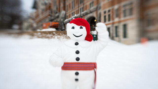 Selective focus photo of Bonhomme, the official snowman representative of the Québec Winter Carnival.