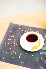 A cup of hot tea brewed with cinnamon and ginger