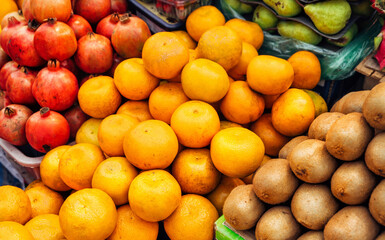 Lots of different ripe fruits on the market in Asia. Fruity multicolored background