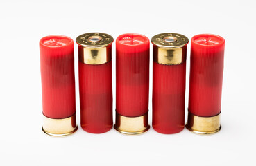 Red shotgun shell cartridge in a row on white background