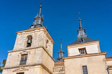 Church towers and monumental palace in the tourist town of Nuevo Baztan next to Madrid, Spain.