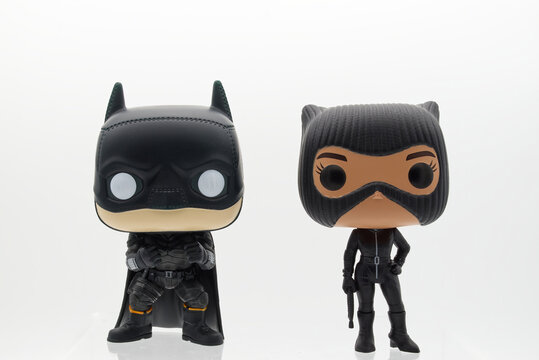 Bologna - Italy - February 14, 2023: The Batman and Catwoman action figure on white background. Batman from DC comics.
