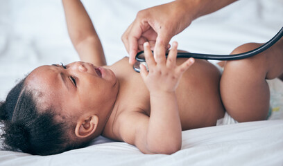 Baby, health and pediatrician hand, stethoscope and listen to heart, medical checkup and childhood...