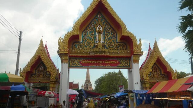 Chalong Buddhist temple main entrance  with street market at Phuket Bangkok