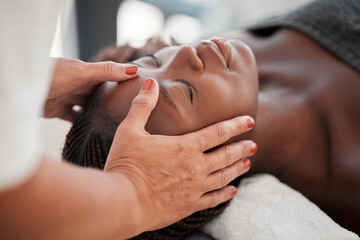 Beauty, relax and black woman getting a facial massage for health, wellness and self care....