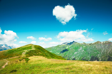 Caucasus mountains. Abkhazia. Heart from cloud in the blue sky. Nature Landscape