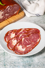 Beef ribeye bacon. Dried Turkish pastrami slices in plate. Traditional Turkish delicacies. Close up