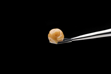 Live Rosin on a dab tool with a black background