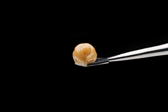 Live Rosin on a dab tool with a black background