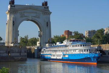 The passenger liner leaves the lock of the Volga-Don Canal and takes passengers on a cruise.