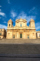 Fototapeta na wymiar travel to Italy - front view of Noto Cathedral (Minor Basilica of St Nicholas of Myra) in Sicily. Vertical view