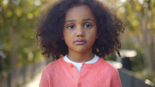 Close up portrait African American girl looking at camera. Realtime