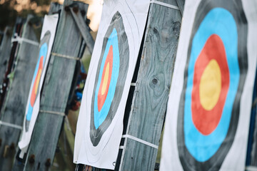 Bullseye target paper, outdoor and field at shooting range for weapon training, aim and accuracy. Sports, archery and poster for gun, bow and arrow at academy for police, army or security for goal
