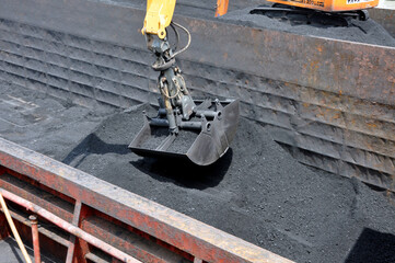 Crane Unloading Coal From the barge 