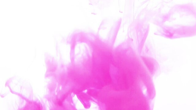 水に噴き出すピンク色のインク　白背景　Pink ink spurting out into the water White background