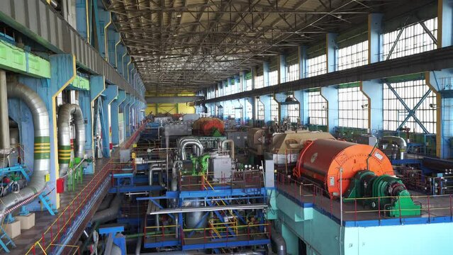 Inside a huge thermal power station, view of pipes and turbines, energy conversion system, environmental issues, power generation system, engineering structure, chp.