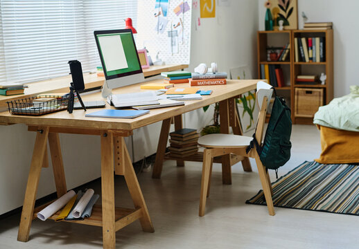 Modern Bedroom Of Teenager With Workplace With Computer On Table