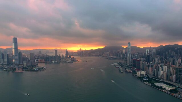Cinematic Hyperlapse of clouds over Victoria Harbour during golden sunrise