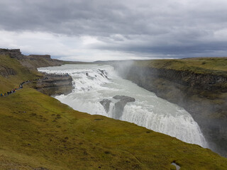 Tourists walking to Gullfoss waterfall in Iceland