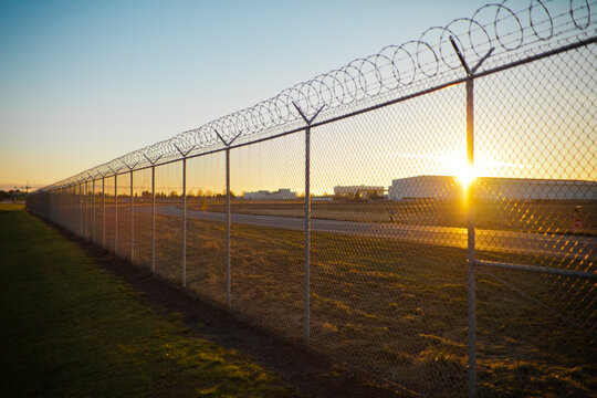 Sunset through a chain linked fence.