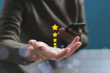 Gesture hand with golden five star awards. Opened hand of customer giving a five star rating....