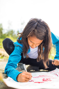 Girl drawing treasure map