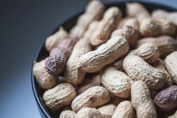 Unpeeled nuts close up. Peanuts.