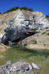 Salt mountain in Romania and a small lake.