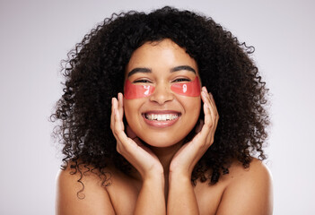 Eye mask, skincare and product with a model black woman in studio on a gray background for beauty...