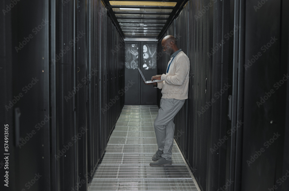 Aufkleber Laptop, network and data center with IT black man for research, engineer working in dark server room. Computer, cybersecurity and analytics with male programmer problem solving or troubleshooting