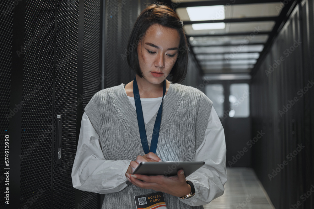 Leinwandbilder Tablet, server room and networking with a programmer asian woman at work on a computer mainframe. Software, database and information technology with a female coder working alone on a cyber network