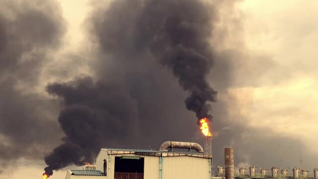 Black smoke pollution of industrial plant, Climate change concept, Emergency blow on flare stack petrochemical industry, Global warning concept, Environment of particulate matter 2.5