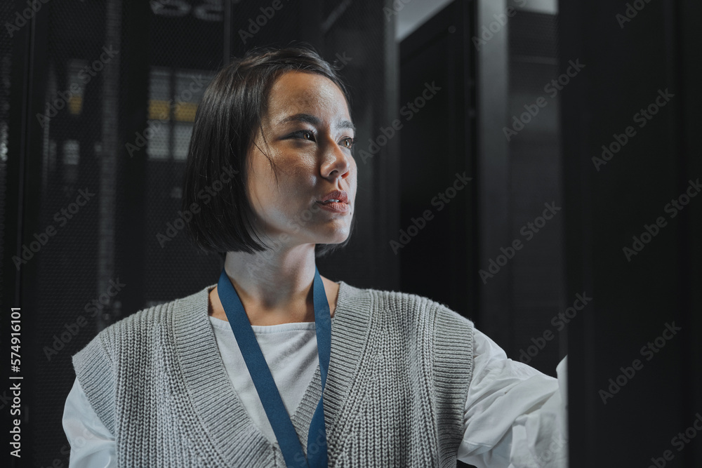 Poster Serious, maintenance or IT woman in server room for analysis, engineer working in data center. Thinking, cybersecurity and girl programmer with tech for problem solving, diagnose or troubleshooting