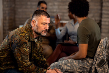 Fototapeta premium Portrait of male veteran in PTSD support group.