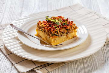 Tasty Strata with meat, mushrooms, cheese, onion