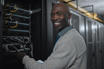 Portrait, server room and black man on tablet for database maintenance or software update at night....