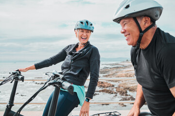 Laughing couple, helmet or electrical bike by sea in transportation, clean energy or sustainability...