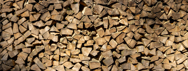 Stack of chopped firewood for wooden background