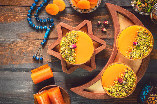 Arabic Cuisine; Dry Apricot Pudding (Qamar Al Deen). Middle Eastern apricot pudding topped with crushed pistachio. It is one of the most famous Ramadan dessert recipe.